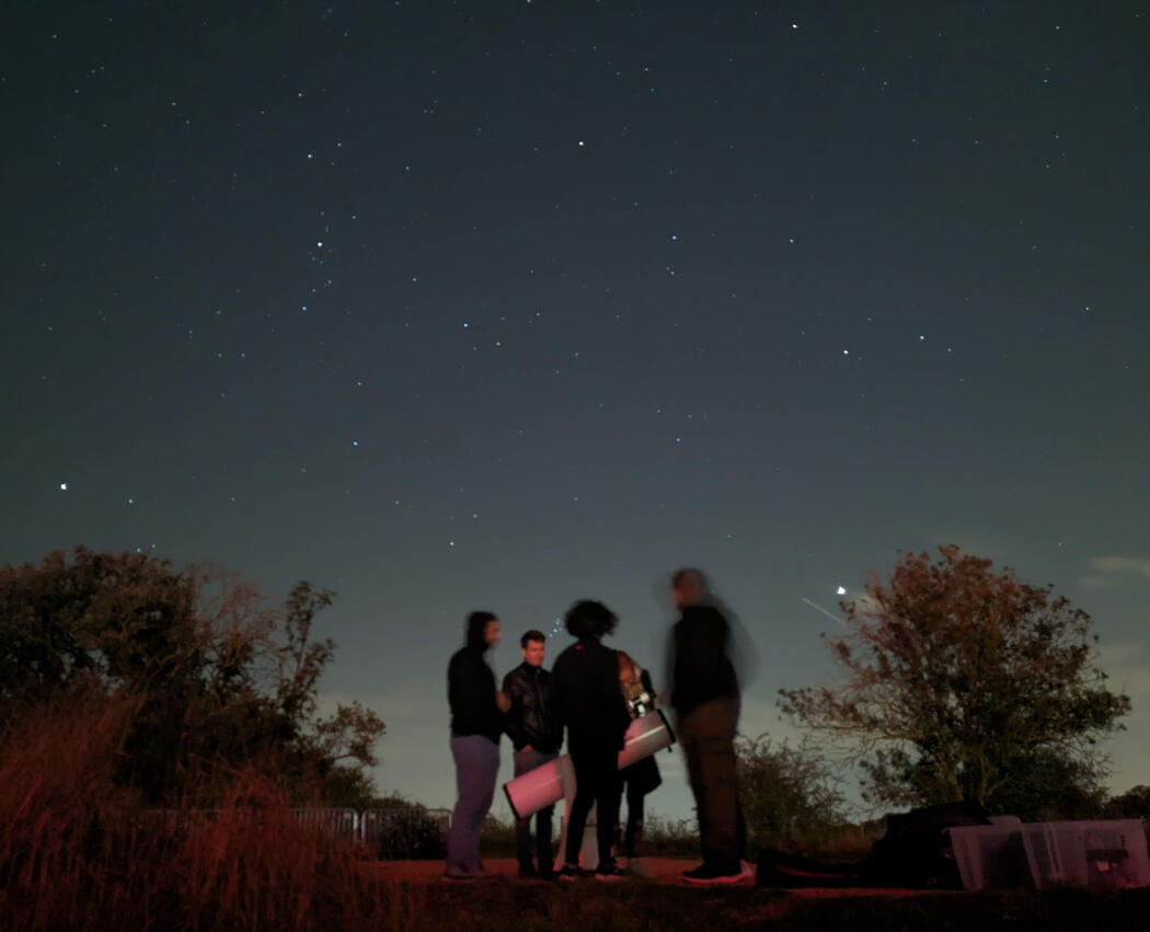 boy looking through dobsonian telescopes